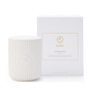 White candle with ribbed texture and matching white box featuring 'ESPA' branding on a white background.