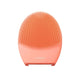 A FOREO Luna facial cleansing device in a vibrant coral orange color, shown against a solid white background.