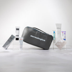 Dermalogica skincare products including a gray travel bag on a white background