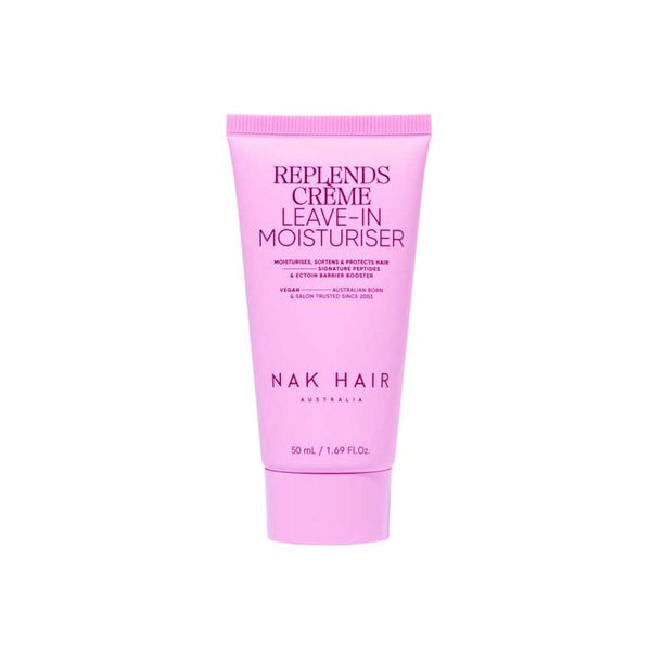Pink tube of NAK Hair Replends Creme Leave-In Moisturiser on a white background