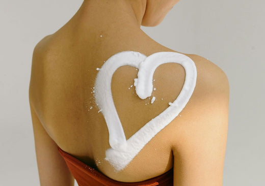 Love heart drawn on someones back in skincare