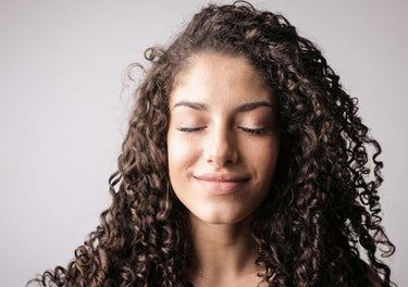 Lady with healthy, hydrated curls