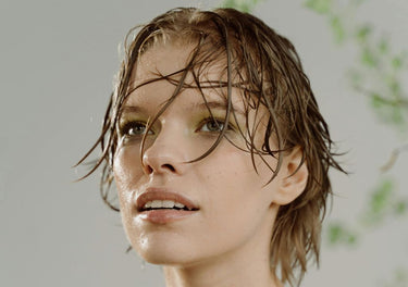 Smiling girl with wet, hydrated skin