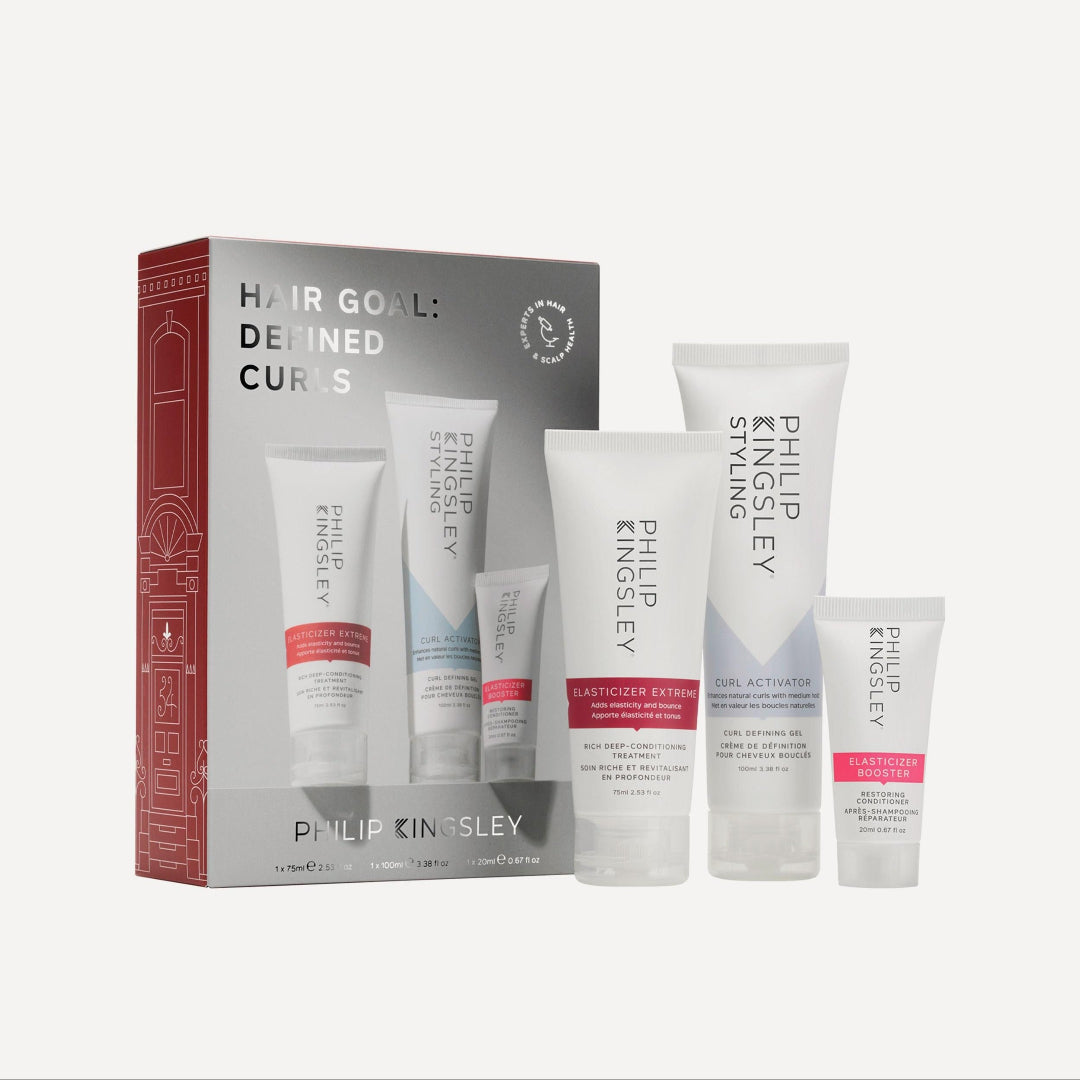 Set of Philip Kingsley hair care products with packaging on a white background