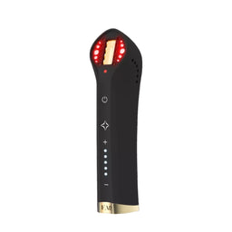 A handheld black LED light therapy device with gold accents and glowing red lights, shown on a solid white background.