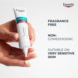 Eucerin Dermovital cream tube held in a hand with product features listed on a light gray background