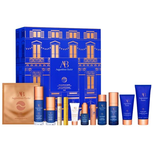 Aggression Baki skincare gift set featuring a large blue building-patterned box, multiple blue and copper cosmetic bottles and tubes, a gold-toned pouch, and a small white tube, arranged on a white background.