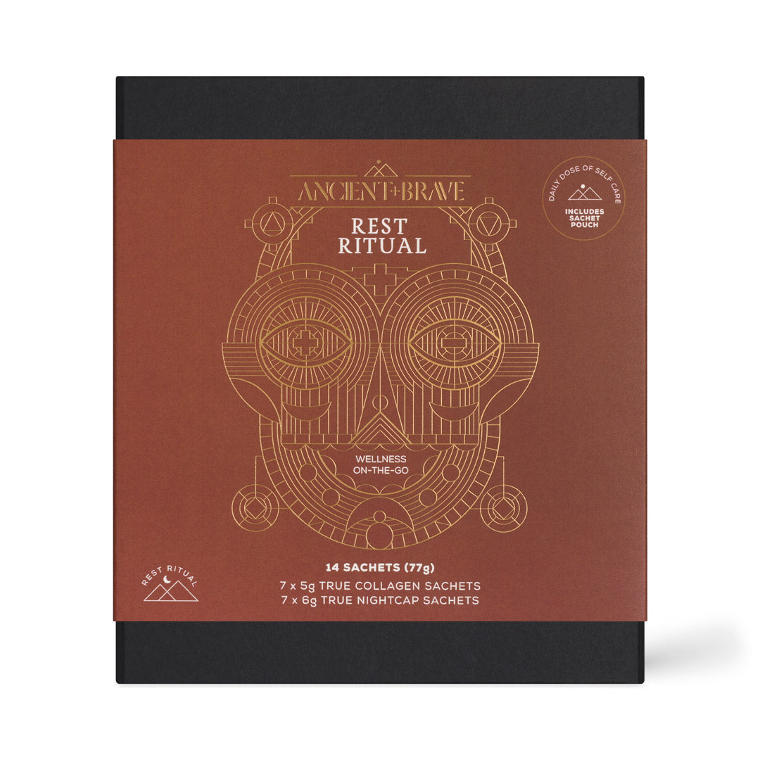 Ancient Brave Rest Ritual wellness supplement packaging, featuring a square box with a terracotta brown front panel and black top and bottom. The front panel has gold line art of a stylized owl and white text reading 'ANCIENT BRAVE', 'REST RITUAL', and product details for 14 collagen and 7 nightcap sachets.