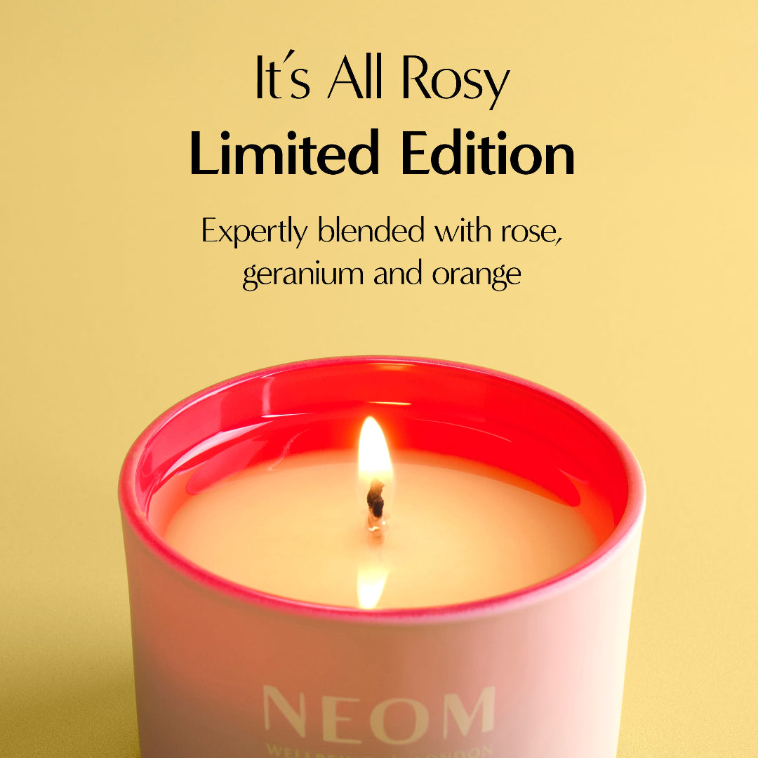 Neom candle with a yellow background and text about the product's fragrance blend.