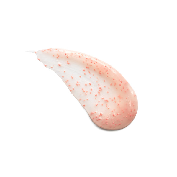 A smear of translucent, semi-foamy cosmetic cream with fine coral-pink speckles, isolated on a solid white background.
