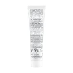 The back of a white squeeze tube of hair product, featuring detailed Spanish text, icons, and logos on a plain white background.