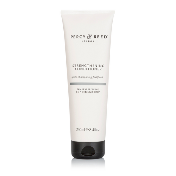 Percy Reed London Strengthening Conditioner in a 250ml (8.4 fl oz) white squeeze tube with a black cap, shown on a clean white background.