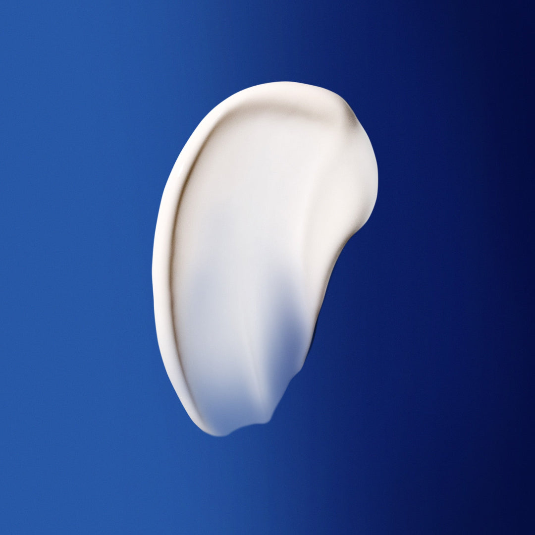 White cream smear on a blue background