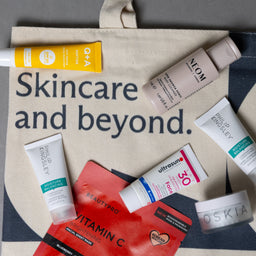 Skincare products on a tote bag with 'Skincare and beyond' text