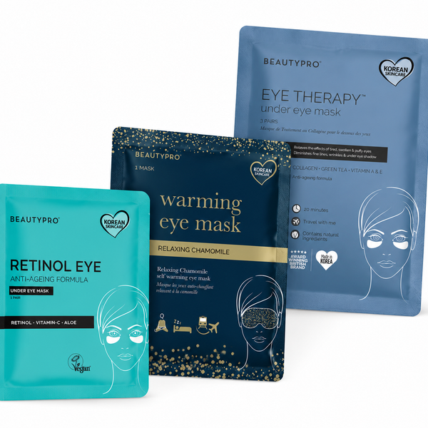 Three BEAUTYPRO under-eye mask packets arranged together on a white background: a turquoise Retinol Eye packet in front, a dark navy Warming Eye Mask packet in the middle, and a medium blue Eye Therapy packet behind.