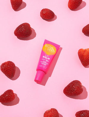 Bondi Sands Lip Balm SPF50+ Wild Strawberry surrounded by strawberries 