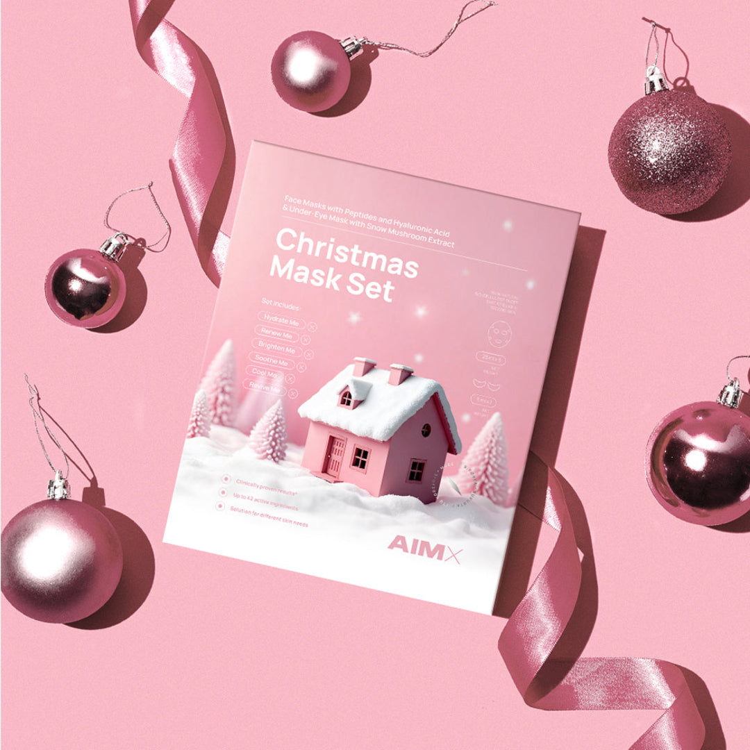 Christmas Mask Set packaging with festive decorations on a pink background
