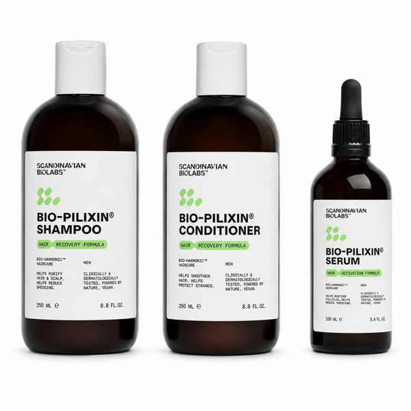 Three Scandinavian Bclabs haircare products on a white background: Bio-Pilixin Shampoo, Bio-Pilixin Conditioner, and Bio-Pilixin Serum. Two large dark amber bottles with white caps are shown on the left and center, and one smaller dark amber dropper bottle with a black dropper cap is shown on the right.