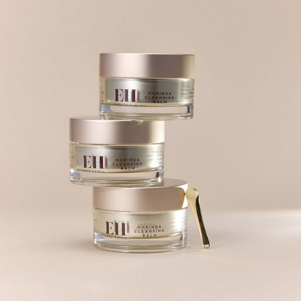 Three jars of Emma Hardie Moringa Cleansing Balm on a beige background