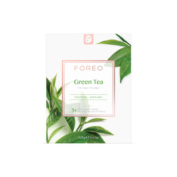 FOREO Green Tea mask packaging with tea leaves on a white background