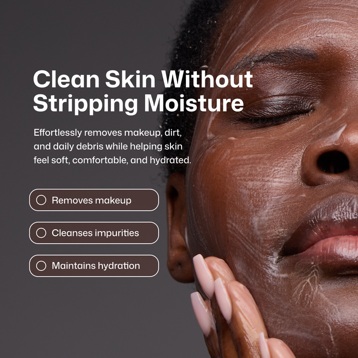 Close-up of a woman with closed eyes applying or washing a white cream onto her face, with marketing text on the left reading 'Clean Skin Without Stripping Moisture' and bullet points about removing makeup, cleansing impurities, and maintaining hydration.