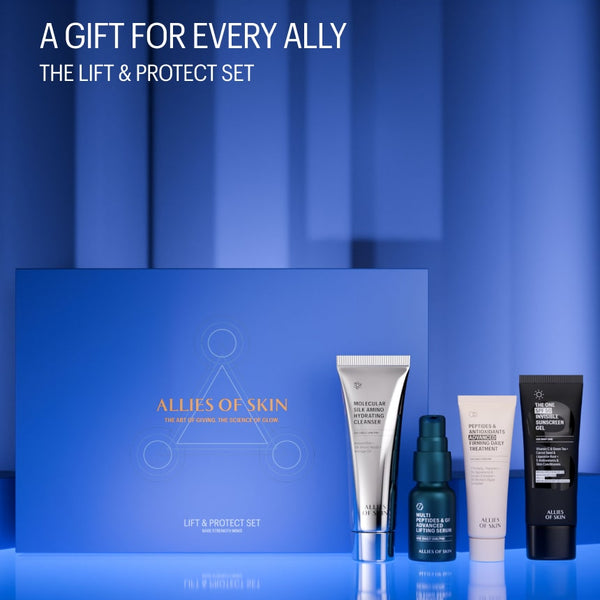 Skincare product set with 'Allies of Skin' packaging on a blue background