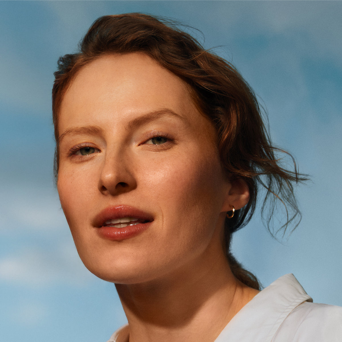 Woman with a light blue sky background