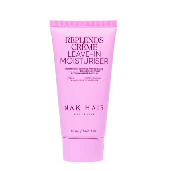 Pink tube of NAK Hair Replends Creme Leave-In Moisturiser on a white background