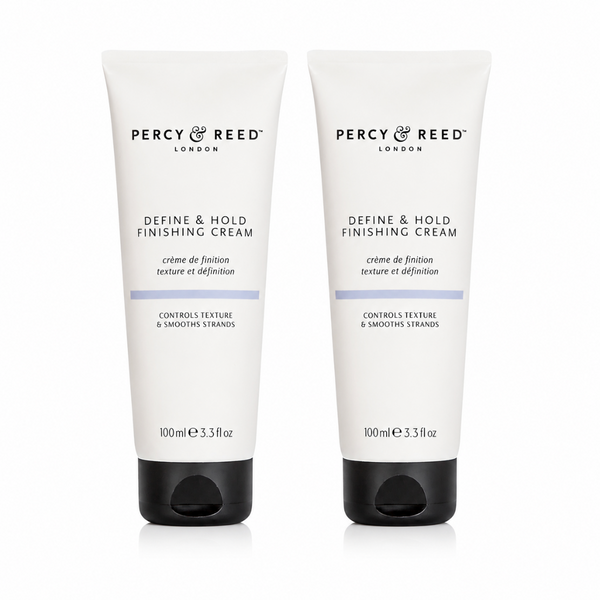 Two white tubes of Percy & Reed Define & Hold Finishing Cream with black caps, displayed side-by-side on a white background.