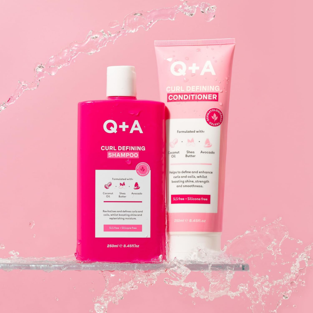 Q+A Curl Defining Shampoo and Conditioner on a pink background with water effects