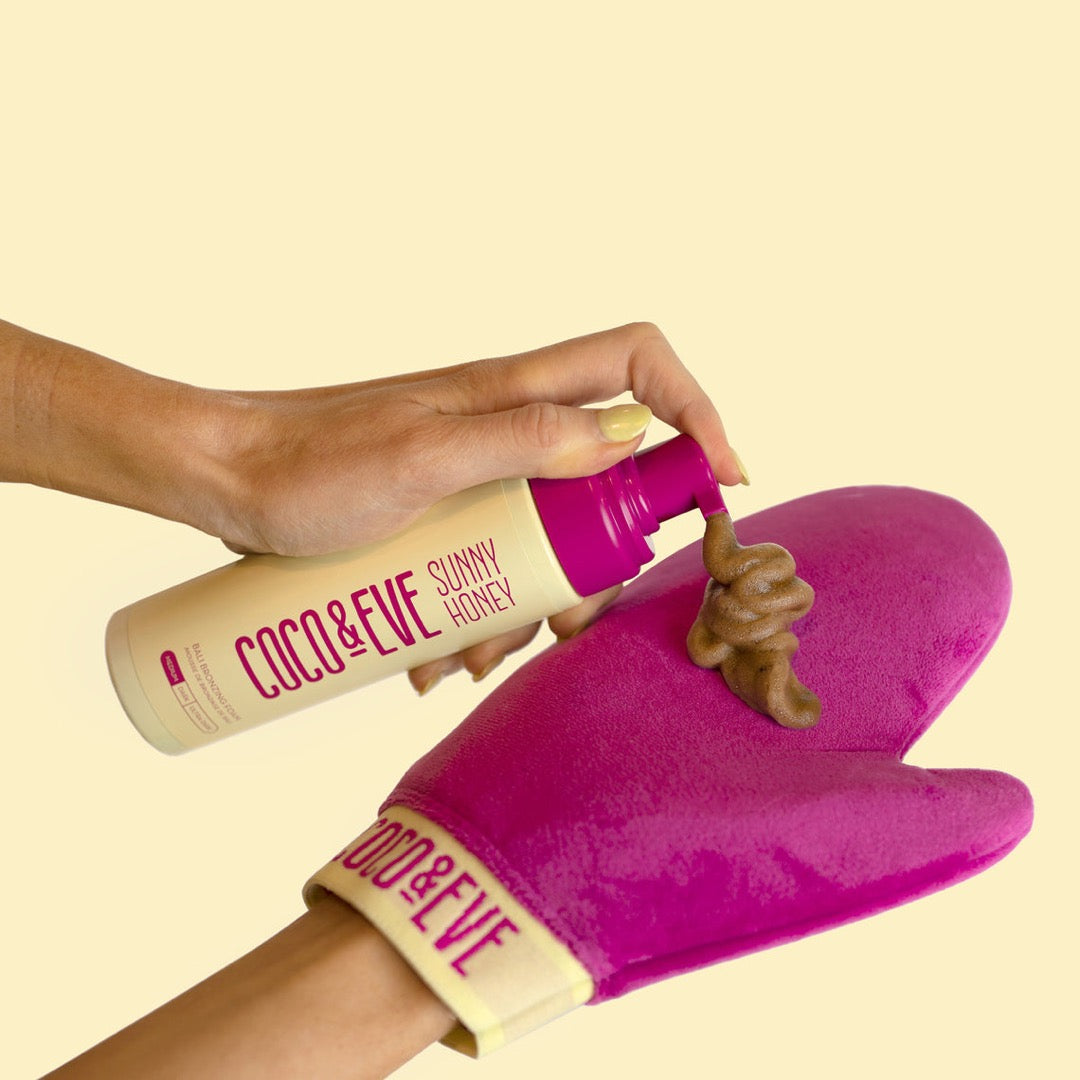 Coco & Eve Sunny Honey Bali Bronzing Foam being applied to a glove