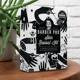 Barber Pro Skin Revival Kit packaging on a wooden surface with a plant in the background