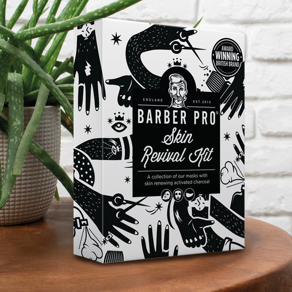 Barber Pro Skin Revival Kit packaging on a wooden surface with a plant in the background