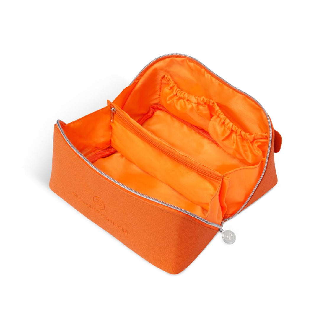 Orange toiletry bag with a silver zipper on a white background