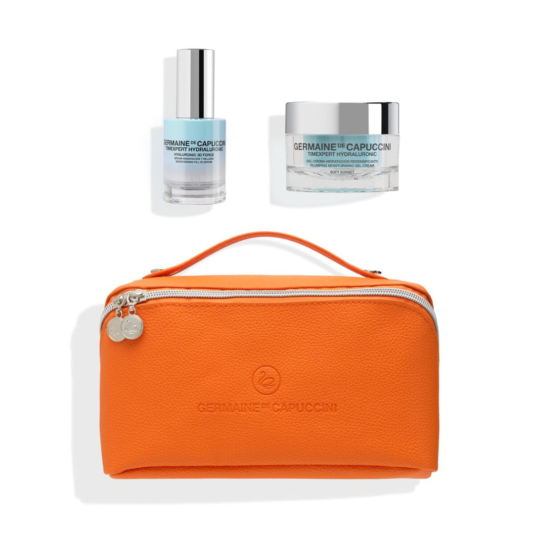 Orange travel pouch with two skincare products on a white background