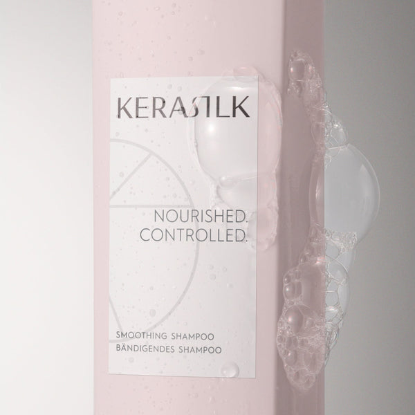 Kerastik shampoo bottle with packaging on a light pink background
