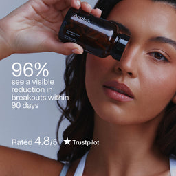 Woman holding a bottle of Apeles skincare product with text about skin improvement and Trustpilot rating.