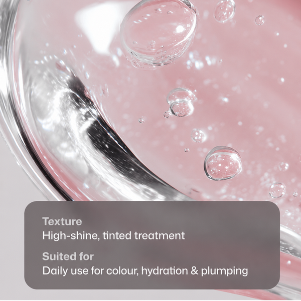 Close-up of a pink cosmetic treatment in a clear glass container with visible bubbles and text overlay describing the high-shine tinted texture and suitability for daily use.
