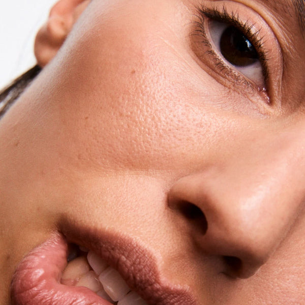 Close-up of a person's face with a neutral expression