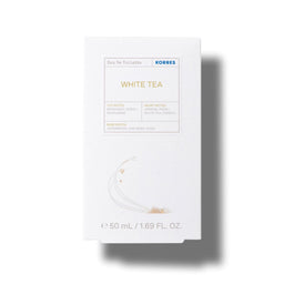 A white rectangular box of KORRES White Tea Eau De Toilette, featuring gold and blue text on a clean white background with a soft shadow.