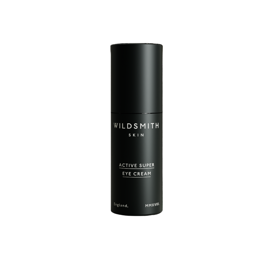 Black eye cream bottle labeled 'Wildsmith Skin' on a white background