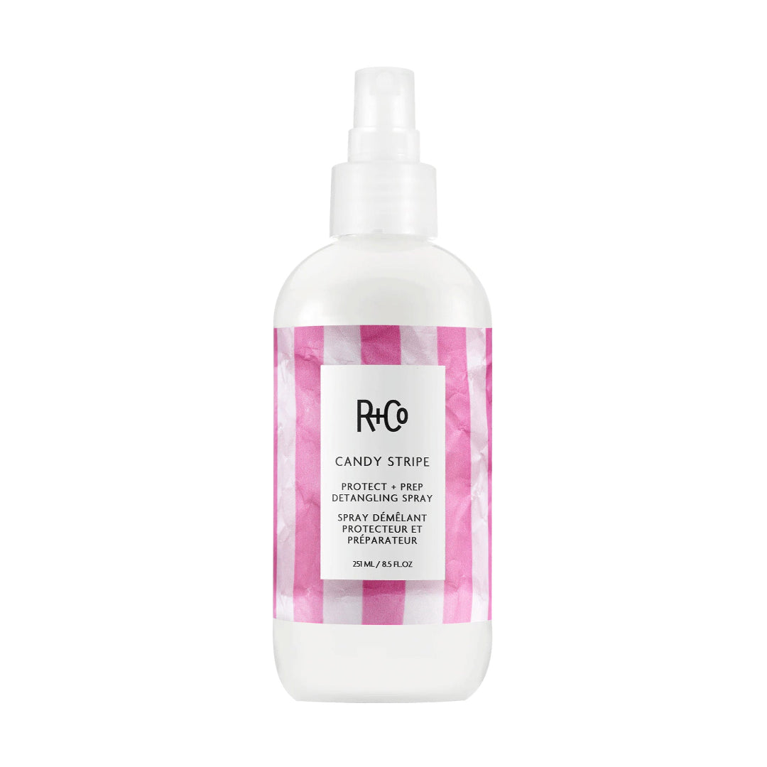R+Co Candy Stripe hair spray bottle with pink and white checkered design on a white background