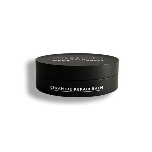 Black container of Wildsmith Ceramide Repair Balm on a white background