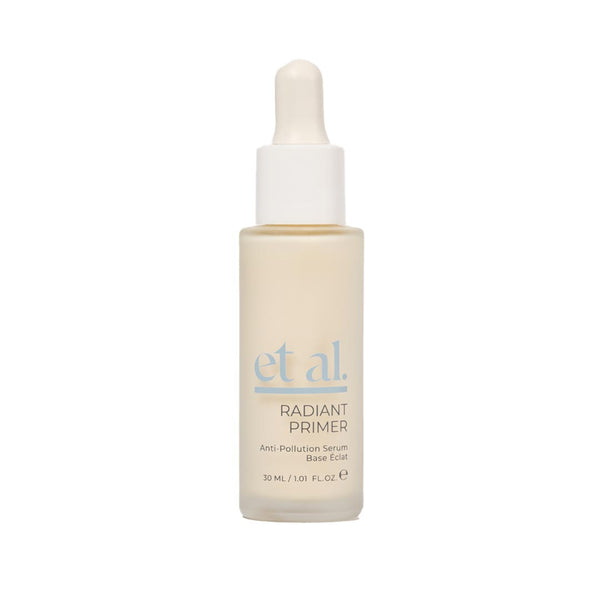 Skincare serum bottle with dropper labeled 'et al.' on a white background