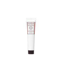 Tube of Frank Body lip balm on a white background