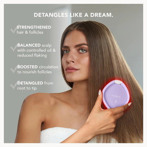 A woman with long, straight brown hair holds a purple and white hair detangling tool against her hair, with marketing text on the left side.