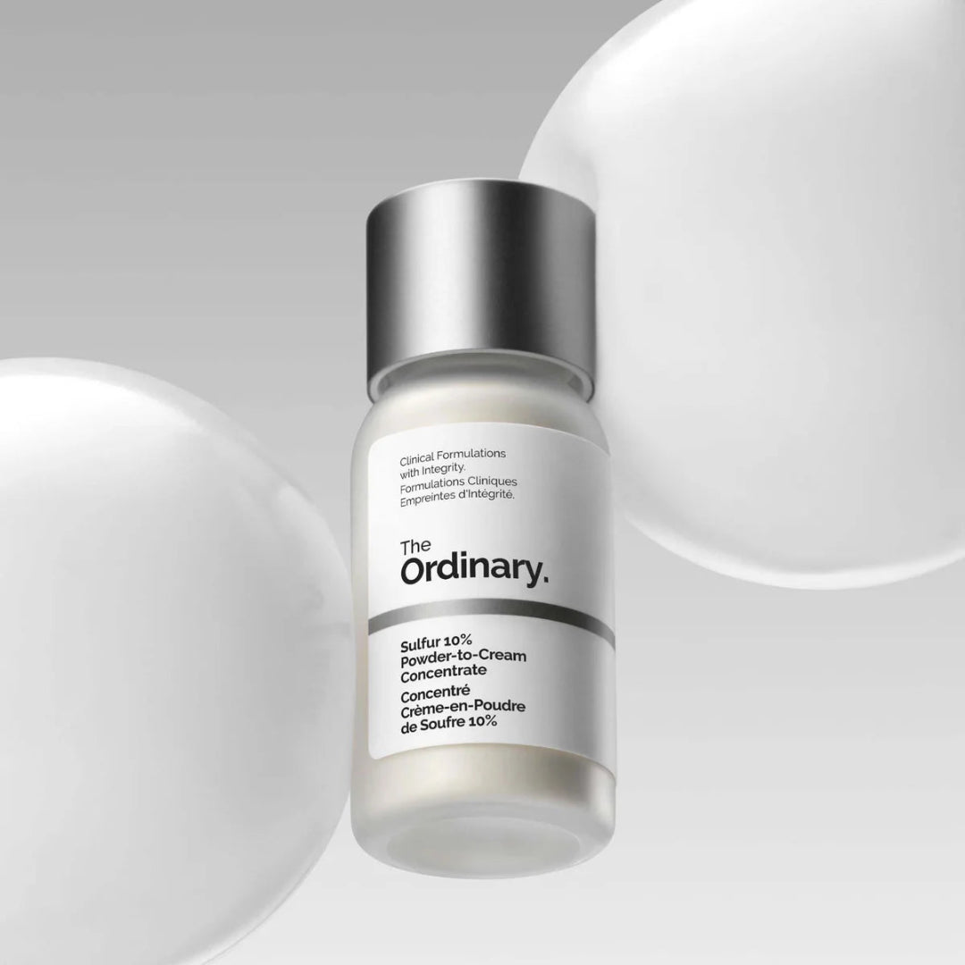 Skincare serum bottle labeled 'The Ordinary' on a gray background