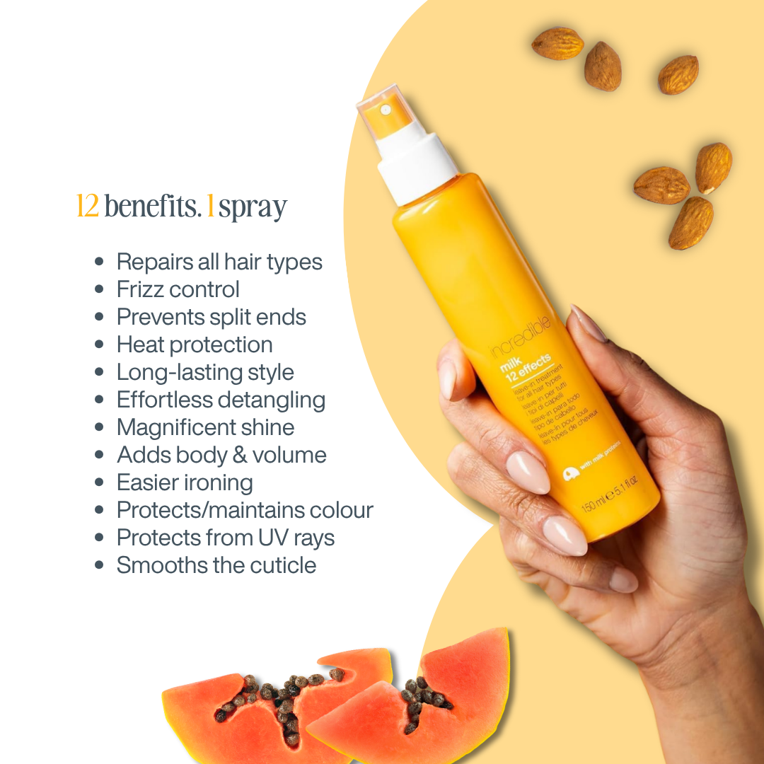 A hand holds a bottle of Morinda 12 benefits.1 spray hair product against a warm beige and yellow graphic background with scattered almonds and papaya slices.