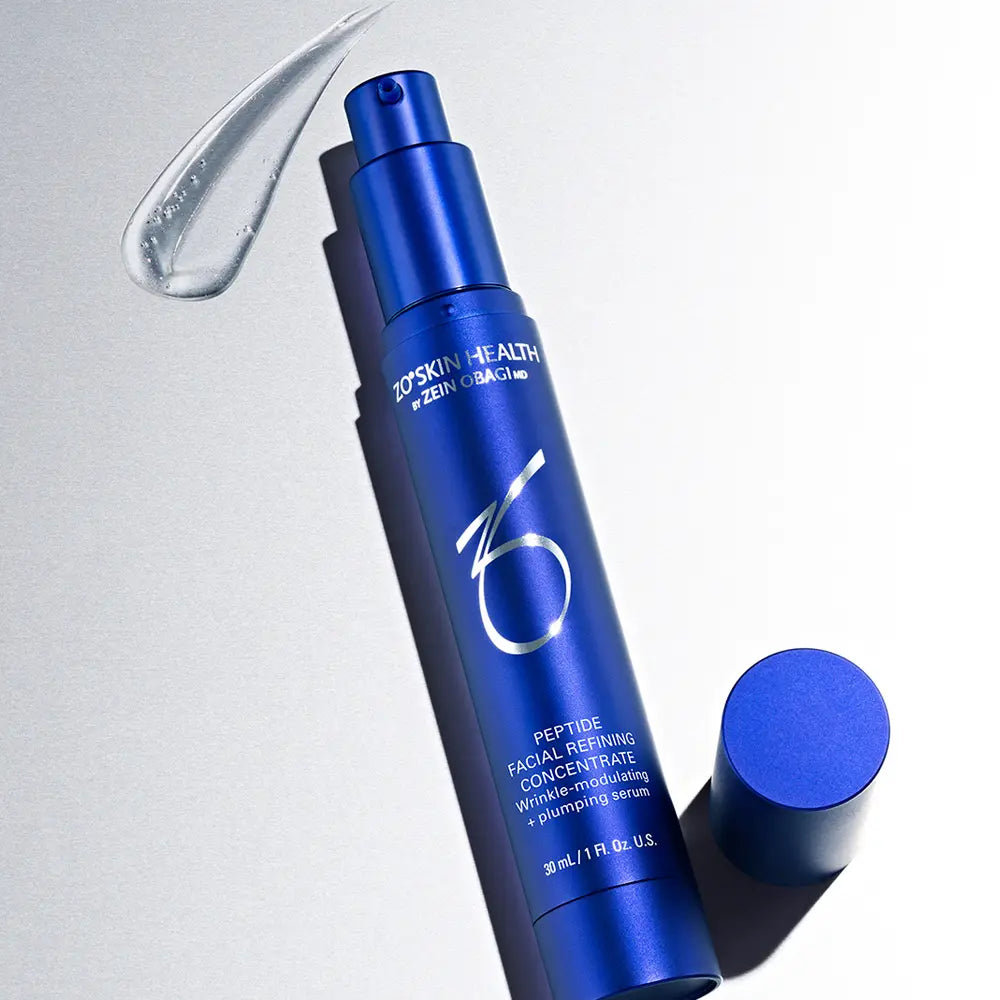 Blue skincare bottle with 'ZO Skin Health' branding on a light gray background