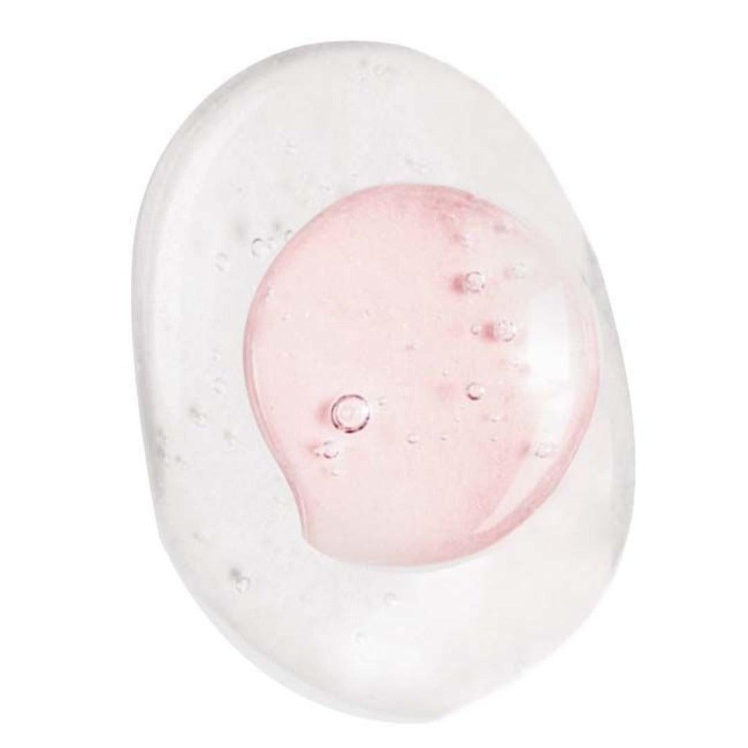 The contents of mesoestetic Bodyshock Intensive Mist poured onto a white background